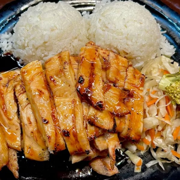 Koto Teriyaki & Sushi's teriyaki chicken with white rice and a side of pickled vegetables.