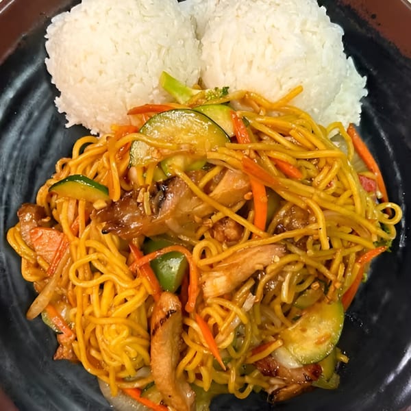 Koto Teriyaki & Sushi's chicken yakisoba with mixed vegetables and two scoops of white rice.
